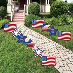 patriotic stars and stripes lawn decorations in front of a house