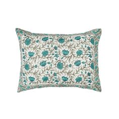 a blue and white pillow with flowers on it