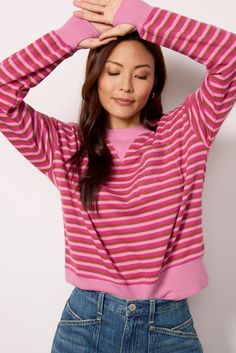 Keep it casual-chic in this striped crewneck sweatshirt by EVEREVE. Finished with dropped shoulders and a left chest pocket, this relaxed pullover features thumbhole cuffs, ribbed trim, and washed knit fabric for a comfortable, lived-in feel. Wear it with jeans, cargo pants, or your favorite leggings. | EVEREVE Women's Charlotte Washed Pocket Crew Top, Size Small, Pink Relaxed Fit Crew Neck Top With Striped Cuffs, Spring Crew Neck Sweater With Striped Cuffs, Relaxed Fit Sweater With Contrast Stripes For Spring, Spring Relaxed Fit Contrast Stripes Sweater, Spring Contrast Stripes Relaxed Fit Sweater, Spring Contrast Stripes Relaxed Sweater, Spring Relaxed Fit Sweater With Contrast Stripes, Fall Tops With Striped Cuffs And Relaxed Fit, Spring Striped Sweatshirt With Contrast Stripes