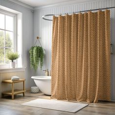 a bathroom with a bathtub, sink and shower curtain in brown polka dot print