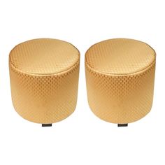 two round stools made out of wood, one is beige and the other has black legs