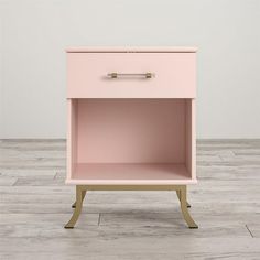 a pink nightstand with two drawers on one side and an open drawer on the other