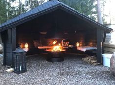 an outdoor fire pit with two beds in it