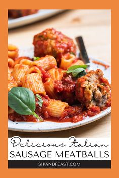 a white plate topped with pasta and meatballs on top of a wooden table next to a fork