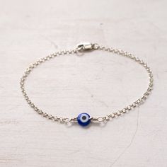 "Dainty Evil Eye Bracelet in Sterling Silver A minimalist take on traditional evil eye protection bracelet. Dainty and lightweight, easy to wear every day. Great on its own or for layering with other bracelets. It will make a wonderful gift for sister, friend, girlfriend. You can pair the cobalt blue bracelet with a matching necklace: https://www.etsy.com/listing/607878204/ MEANING: The evil eye is a curse believed to be cast by a malevolent glare. Many cultures believe that receiving the evil e Cheap Beaded Evil Eye Bracelet For Gifts, Minimalist Blue Evil Eye Bracelet For Everyday, Evil Eye Bracelet Ideas, Evil Eye Jewelry Bracelet, Evil Eye Bracelet Silver, Nazar Bracelet, Turkish Evil Eye, Craft Decorations, Silver Eye