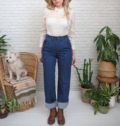 "➳ Vintage 1970's high waisted jeans  ➳ Pleated front details ➳ Dual front side pockets and pocketless rear  ➳ Relaxed long straight legs that we love worn cuffed up  ➳ Dark indigo blue denim ➳ Made in Canada  Measurements   Estimated fit: 26 to 27 waist depending on desired fit  ✿ please go by measurements below  ✿ ( Taken laying flat )  Waistband: 13.5\" / 27\" doubled Hips: 18.5\" / 37\" doubled Front rise: 12\" Inseam: 32.5\" un-cuffed or 28.5\" as shown cuffed in photos Back rise: 14\"  Hem width: 9.25\"  Label & Fabric  Wrangler 100% Cotton Made in Canada  Condition  Great vintage condition. Few picks to threads/fraying on on left inner thigh and left side pockets. Freshly cleaned and ready to wear on arrival.   Model Reference  Model reference: is 5'6 / Size 4 / Size Small / Bust: 3 Retro Denim Bottoms For Workwear, Retro Flare Jeans For Workwear, Retro Rigid Denim Bottoms For Fall, Retro Style Dark Wash Jeans For Workwear, Retro Dark Wash Jeans For Workwear, Dark Wash Retro Jeans For Work, Retro Denim Jeans For Workwear, Retro Dark Wash Jeans For Work, Dark Wash Retro Jeans For Workwear