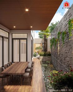 an outdoor dining area with wooden table and chairs next to the water feature, surrounded by greenery