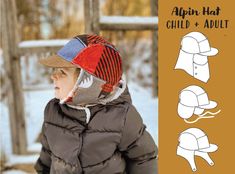 a child wearing a hat and jacket with an animal pattern on the front, while standing in the snow