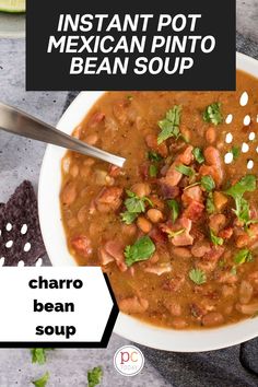 a white bowl filled with beans and cilantro on top of a gray table