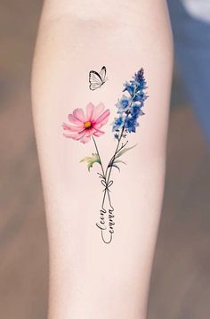 a woman's leg with flowers and butterflies on the side of her body,