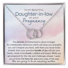 a necklace with the words daughter - in - law on it and an image of two inter