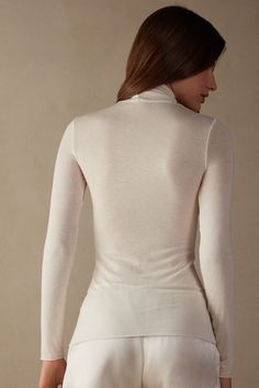 Modal Cashmere Ultralight High-Neck Top | Intimissimi Elegant Fine Knit Turtleneck For Layering, Elegant High Stretch Tops With Thumbholes, Elegant Stretch White Turtleneck, Elegant White Stretch Turtleneck, Elegant Second-skin Long Sleeve Tops, Elegant Fine Knit Top With Funnel Neck, Elegant Fine Knit Funnel Neck Top, Elegant Fine Knit Turtleneck For Spring, Versatile Fine Knit Turtleneck Top