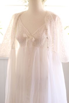 Floor-length Lace Trim Nightgown For Wedding, Floor-length Wedding Nightgown With Lace Trim, V-neck Wedding Nightgown With Delicate Lace, White Lace Nightgown For Wedding, White Lace Wedding Nightgown, Lace Gown With Sheer Bodice For Wedding Night, Feminine White Gown With Lace Trim, White Feminine Gown With Lace Trim, Feminine White Lace Gown