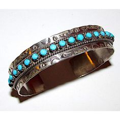 Stunning vintage Native American Zuni intricately hand etched sterling silver and "snake eye" Sleeping Beauty turquoise cuff bracelet. Wonderful craftsmanship and attention to detail, intricately hand etched design with ingot tribal symbols, accented with a row of round "snake eye" Sleeping Beauty turquoise on the front. The inside circumference is about 6 1/2" including the gap and the cuff can be carefully adjusted. Hallmarked, stamped sterling. Great as a stacker cuff. Wonderful example of wearable Native American art to add to any jewelry collection. Spiny Oyster Jewelry, Vintage Native American Jewelry, Turquoise Bracelet Cuff, Royston Turquoise, Turquoise Cuff, Sleeping Beauty Turquoise, Fall Jewelry, American Jewelry, Native American Jewelry