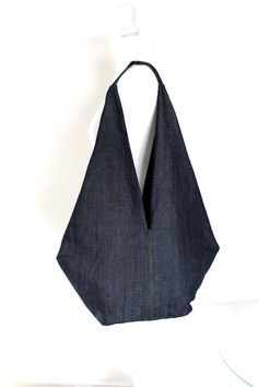 a bag made out of denim on a mannequin