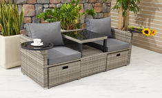 two wicker chairs sitting next to each other on top of a white tile floor