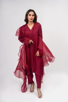 A maroon cotton raw silk suit with matching maroon sequins with cut work on the sleeves and paired with a matching colored net organza dupatta. 3-Piece Suit Ready to wear Red Cotton Silk Sets With Dupatta, Elegant Slub Silk Churidar With Sheer Dupatta, Cotton Silk Churidar With Sheer Dupatta, Long Sleeve Cotton Silk Churidar With Sheer Dupatta, Red Cotton Silk Set With Sheer Dupatta, Long Sleeve Slub Silk Salwar Kameez With Sheer Dupatta, Elegant Slub Silk Sets With Mirror Work, Red Cotton Silk Dress With Dupatta, Party Kurta With Sheer Dupatta In Slub Silk