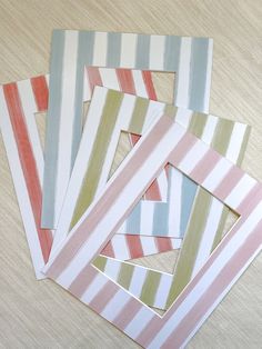 four pieces of paper with different colored stripes on them