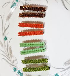 These are nice, simple but pretty barrettes, can be worn for any occasion. They are 60mm or 2.5 inches long and approx 5mm or 1/4 inch wide. They are made with 4mm crystals with four colours to choose from Peridot/Olivine Green, Mint green Jade, orange crystal, and Metallic Copper Brown. They are very well made. Metallic Copper, Orange Crystals, Jade Green, Barrettes, Mint Green, Crystal Beads, Jade, Mint, Hair Accessories