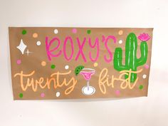 a brown paper sign that says roxy's twenty first with a cactus on it