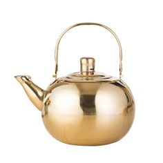 a gold tea pot with a handle on it's side and a white background