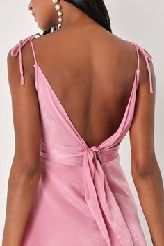 Raise a glass and toast to how good you look in the Party with Prosecco Pink Satin Tie-Back Mini Dress! Sleek woven satin shapes this party-perfect dress that has tying straps, a cowl neckline, and a sleeveless bodice that ties at the back. A high waist tops an A-line skirt with a mini hem. Hidden back zipper/clasp. Fit: This garment fits true to size. Length: Mid-thigh. Size medium measures 30" from adjustable straps to hem. Bust: Great for any cup size. Waist: Fitted - very fitted at natural w Spring Party Satin Backless Dress, Spring Party Backless Satin Dress, Spring Party Mini Dress With Bias Cut, Spring Backless Satin Dress For Party, Spring Party Satin Dress, Backless, Feminine Tie Back Mini Dress For Party, Dressy Bias Cut Party Dress, Flirty Party Mini Dress With Tie Straps, Summer Party Satin Dress With Bias Cut