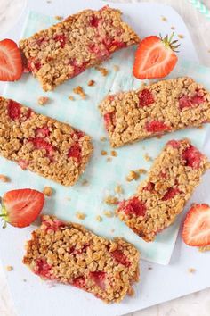 strawberry oatmeal bars on a plate with strawberries