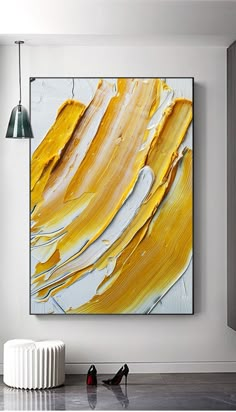 an abstract painting hangs on the wall next to a radiator and two lamps