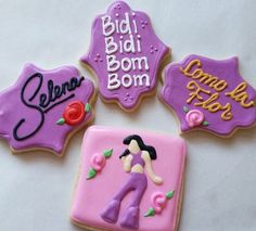 three decorated cookies with the names of different women and men in purple, pink, and yellow