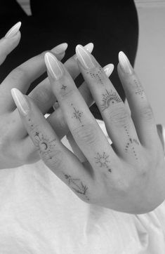 two hands with different tattoos on them