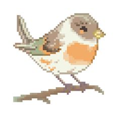 a cross stitch bird sitting on top of a branch