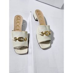 This Authentic Gucci Leather Zumi Slide Off-White Size 38 Is In It’s Good Pre-Owned Condition. The Exterior Is Clean. The Interior Is Clean. The Top Of The Shoe Towards The Gold Hardware Shows A Little Bit Of Black Stains To It And It Is Due To The Gold Buckle On It. Kindly Note That This Shoe Is Best Fit For A Slim Fit. Size: 38 Gucci Leather, Black Stains, Gucci Shoes, Gold Hardware, Buckle, Off White, Slim Fit, Gucci, Exterior