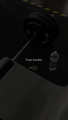 the gym equipment is sitting on the floor next to the water bottle and weight scale