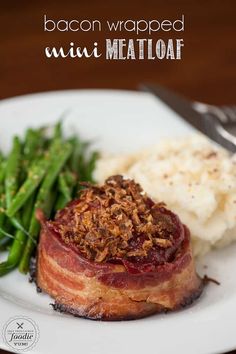 a white plate topped with meat and green beans