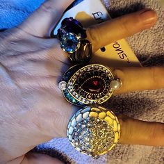 1st Ring Is So Pretty! Purple, Lt.Blue &Smoky Topaz Colors Tones With Silvertone Stretch Band 5,6,7&Maybe 8 $25 Retail.2nd Ring Double Layer Greeb,Red&Rhinestones W/Pearl Accents $25 Retail.Pretty White Rhinestones And Creme Enamel,Silvertone Stretch Os. $15 Stretch Rings, Smoky Topaz, Stretch Ring, Topaz Color, Stretch Band, Pretty Purple, Stretch Bands, White Rhinestone, Red Rhinestone