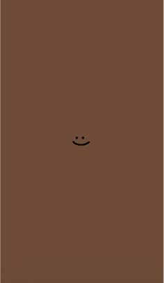 a brown square with a smiley face drawn on it