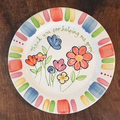 a plate with flowers painted on it that says, thank you for helping me today