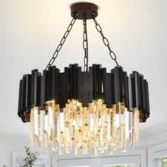 a chandelier hanging over a dining room table