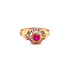 Such an eyecatch! This Victorian era ring is made in lush 18K gold and set with a synthetic red ruby in the center that shimmers in the light. Surrounding that mesmerizing stone is a halo of white diamonds that are pave set and total to .05ctTW. The head of the ring measures 9.41mm long, 9.71mm wide and sits 5.11mm tall. The ring is a size 7 and weighs 1.3DWT.  C9168BYVPM  --Please reference our policy for more details--***For International orders, please provide a phone number for shipping purp Red Oval Cluster Ring With Rose Cut Diamonds, Red Ruby Diamond Ring Hallmarked, Antique Red Diamond Ring With Rose Cut Diamonds, Red Ruby Cluster Ring With Center Stone, Heirloom Red Gold Signet Ring, Red Rose Cut Diamond Ring, Victorian Gold Diamond Ring With Ruby, Victorian Ruby Ring With Diamond Center Stone, Antique Style Brilliant Cut Yellow Gold Ruby Ring