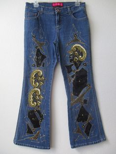 "HAND-EMBELLISHED Glo Denim Blue Floral Design Embellished JEANS ✽ ✽ ✽ Original Floral Print Design, Hand-embellished by Iva Boutique ✽ ✽ ✽ BRAND - Glo SIZE - 9 short MATERIAL  ---- 75% cotton  23% Polyester 2% spandex WAIST------------30\" HIPS ------------ 38\" RISE ------------- 9\" INSEAM -------- 28 1/2\" PATTERN ------- floral print CONDITION ----- new MATERIAL ------- sequin & glue glitter CLOSURE ------- front zipper PACKETS --------- front & back pockets WASH ----------- hand cold wash Embellished Fitted Jeans For Fall, Casual Embellished Jeans For Party, Casual Embellished Party Jeans, Embellished Denim Bottoms For Fall, Embellished Straight Leg Jeans For Party, Casual Embellished Fitted Bottoms, Embellished Fitted Casual Bottoms, Embellished Blue Bottoms For Fall, Fall Embellished Denim Bottoms