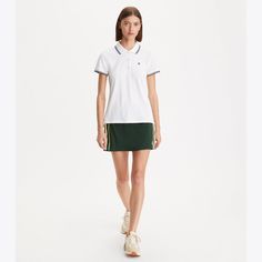 Our side-stripe tennis skirt is a timeless style updated with innovative performance fabric. Crafted in our signature tech piqué, it is breathable, moisture wicking and offers stretch for full range of movement. The skirt is detailed with a knitted-tape side stripes and includes a built-in boy short and ball pocket. Fitted White Tennis Skirt With Contrast Trim, White Fitted Tennis Skirt With Contrast Trim, Sporty Fitted Tennis Skirt With Contrast Trim, Designer Bottoms, Tennis Skirt, Side Stripe, Performance Fabric, Boy Shorts, Designer Outfits Woman