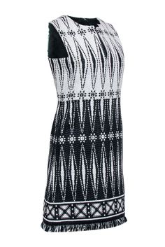 Slip into some chic vacation style with this gorgeous dress from Tory Burch. Woven geometric patterning lends elaborate detail to the flattering shift silhouette, while the fun fringe trim adds a playful touch. Finished with a flirty split neckline, this charming number pairs perfectly with wedge espadrilles. Size 2 Shell 43% Nylon, 32% Polyester, 25% Cotton Lining 95% Polyester, 5% Spandex Hidden back zip Sheath silhouette Split neckline Fringe trim Sleeveless Bust 34" Waist 31" Shoulder to hem 35.5" Black Geometric Pattern Sleeveless Dress, Black Sleeveless Dress With Geometric Pattern, Fitted Dress With Geometric Pattern For Vacation, Chic Fitted Dress With Geometric Pattern, Elegant Black Dress With Geometric Pattern, Elegant Black Dresses With Geometric Pattern, Elegant White Dress With Geometric Pattern, Wedge Espadrilles, Buy Shoes Online