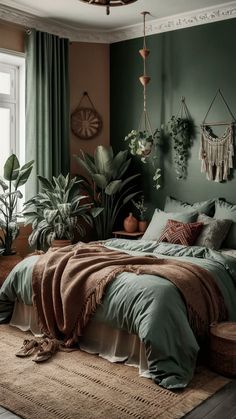 a bedroom with green walls and plants in the corner