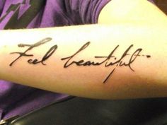 a person with a tattoo on their arm that says feel beautiful