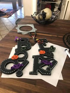 the letters are made out of paper and decorated with pumpkins