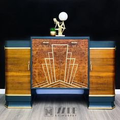 an art deco sideboard with wood and brass accents