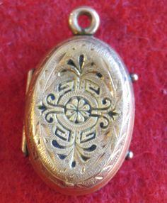 "An Awesome 1890's Victorian 14 Karat Yellow Gold Locket With Photos Necklace Pendant. Visit our shop for awesome retro photos, vintage jewelry, sports memorabilia and home decor. Size: 1/2\" across x 3/4\" high Material: 14 Karat Yellow Gold Condition: Good. Front Is Bowed In. Photos Show Wear. Year: 1890's Signed: Unsigned. Inventory #: 2280" Victorian Medallion Jewelry For Vintage Events, Antique Medallion Necklace For Vintage Events, Victorian Locket Necklaces For Vintage Events, Victorian Jewelry With Intricate Design For Collectors, Vintage Filigree Pendant Jewelry, Antique Gold Jewelry With Vintage Charm For Collectors, Victorian Style Intricate Collectible Jewelry, Vintage Hallmarked Antique Gold Jewelry, Vintage Antique Gold Hallmarked Jewelry