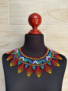 This choker is a unique piece made entirely by hand by Huichol artisans, very colorful boho style, to wear on any occasion. The Huichol artisans base all their works and their designs on visions they have during their sacred rituals proper to their ethnicity, The Huicholes inhabit the states of Nayarit, Jalisco, Zacatecas and Durango. Piece made by artisans nayaritas. Sent anywhere in the world from Tepic, Nayarit. Colorful Beaded Choker For Festivals, Colorful Beaded Choker Necklace For Festival, Colorful Traditional Beaded Necklaces For Festivals, Traditional Multicolor Handwoven Choker, Traditional Multicolor Beaded Choker Necklace, Multicolor Beaded Necklace Choker For Festivals, Multicolor Handwoven Festival Choker, Multicolor Handwoven Choker For Festivals, Artisan Multicolor Choker For Festival