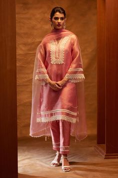 Pink straight kurta with botanical print and lace work. Paired with a pant with scallop lace and dupatta with placement lace work. Comes along with a separate slip.
Components: 4
Pattern: Print
Type Of Work: Botanical
Neckline: V neck
Sleeve Type: Bell Sleeves
Fabric: Organza
Color: Pink
Other Details: 
Model height: 5ft 9inches, wearing size XS
Ombre dupatta
Occasion: Puja - Aza Fashions Bell Sleeves Pakistani Suits, Suit Sleeves Designs Indian Style, V Neck Pakistani Suit Design, Bell Sleeves Suit Design, Straight Suit Designs With Pants, Organza Sleeves Style For Kurti, Bell Sleeves Suit, Indian Designer Suits Party Wear Beautiful, Lace Kurta Designs Women