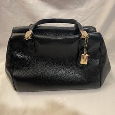 Authentic Coach Black Pebble Leather Purse, Clasp On Extended Strap Is Broken(See Photo), Great Clean Pre-Owned Condition, Original Purchased From Dillard's Black Pebbled Leather Satchel For Work, Black Pebbled Leather Satchel For Office, Black Pebbled Leather Shoulder Bag, Elegant Black Pebbled Leather Shoulder Bag, Formal Black Pebbled Leather Shoulder Bag, Coach Textured Leather Satchel For Office, Elegant Coach Satchel With Metal Hardware, Elegant Pebbled Leather Shoulder Bag With Branded Hardware, Elegant Shoulder Bag With Pebbled Leather And Branded Hardware